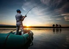 A group of anglers gathered around a fishing dock, engaged in conversation and sharing fishing tips and techniques, representing the camaraderie and knowledge-sharing aspect of fishing forums.